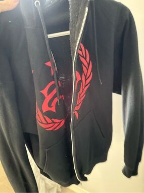 TC Black Zip-Up Hoodie with Red Crest Graphic